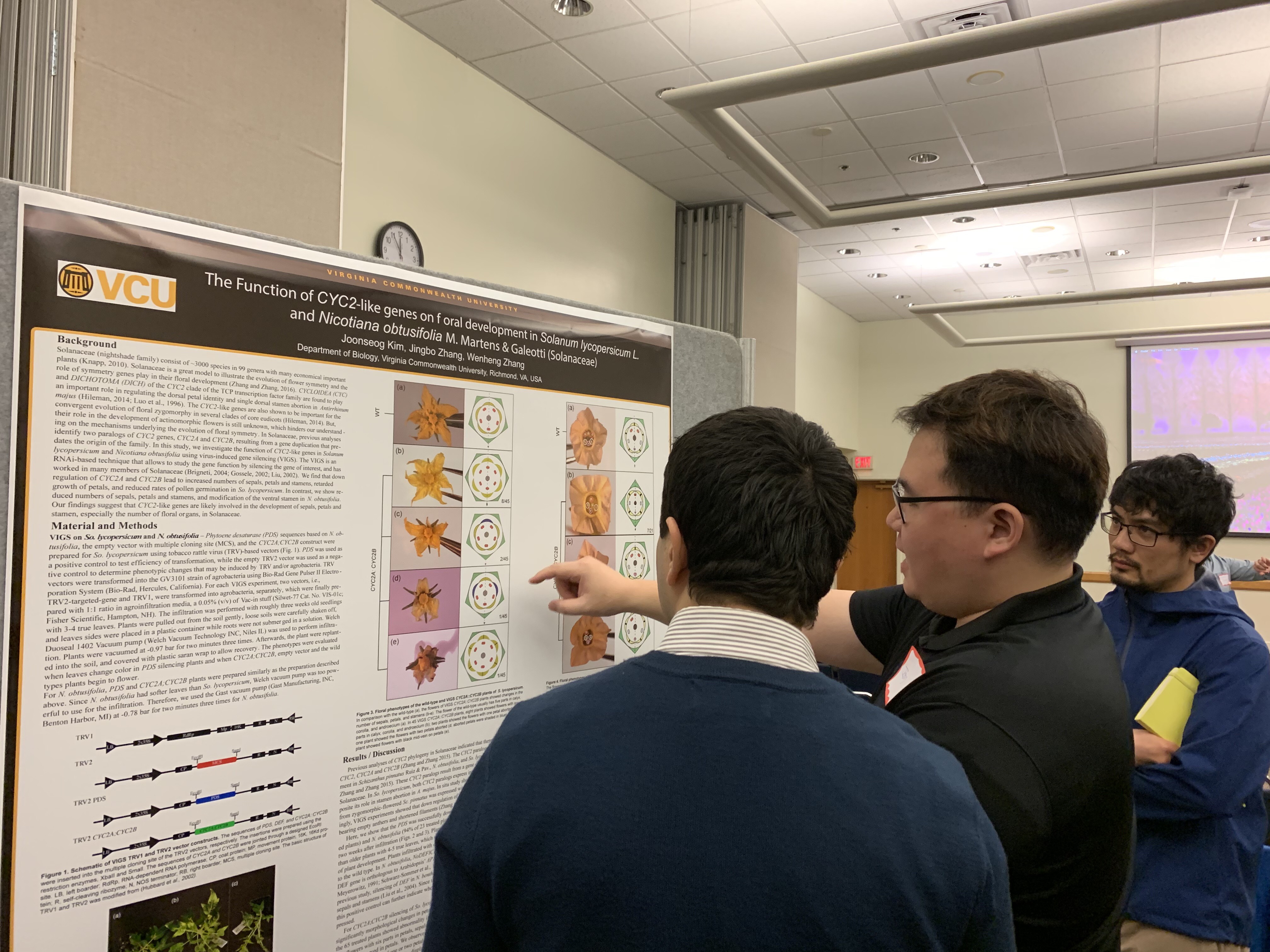 Joon Kim presenting a poster at ILSSO Research Symposium 2019